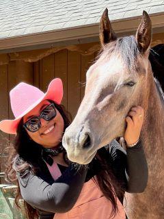 Woman petting horse face